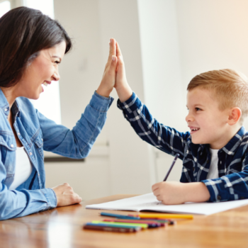 Parent praising child to boost self-confidence and self-esteem.